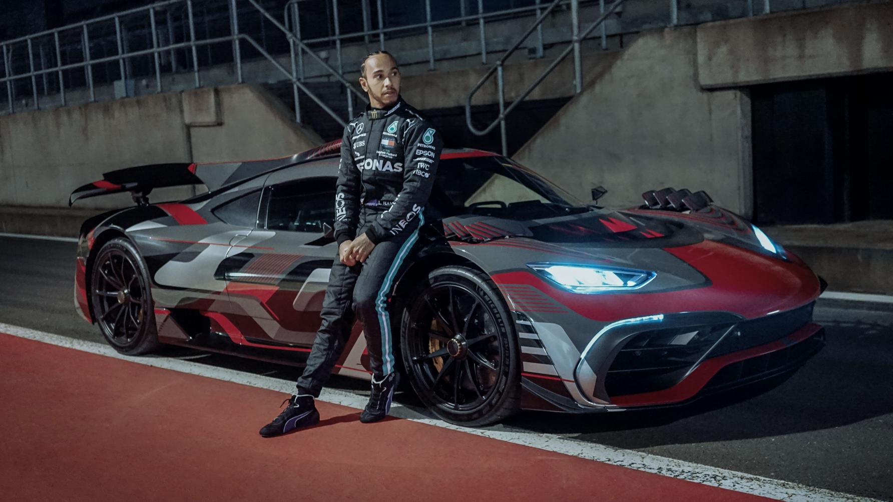 Lewis Hamilton poses with the Mercedes-AMG One