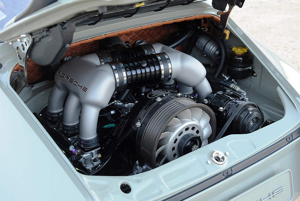 There's not much room creativity in the back of a standard 911, but give Singer some quilted leather and they'll work wonders.