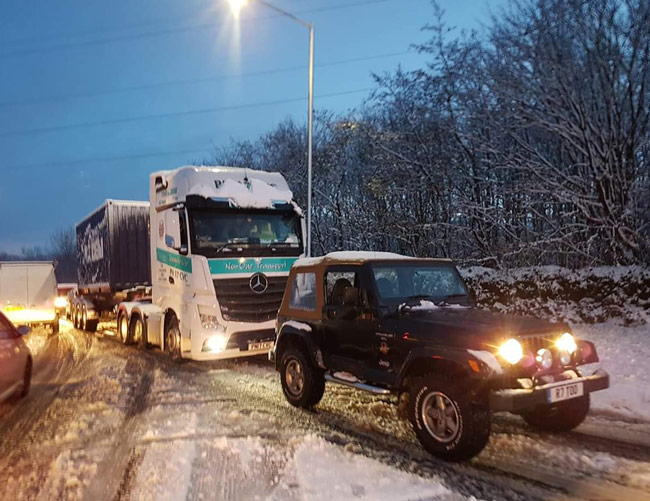 Owner of 20-Year-Old Jeep Wrangler Praised as Hero for Pulling 44-Ton Truck From Snow Drift