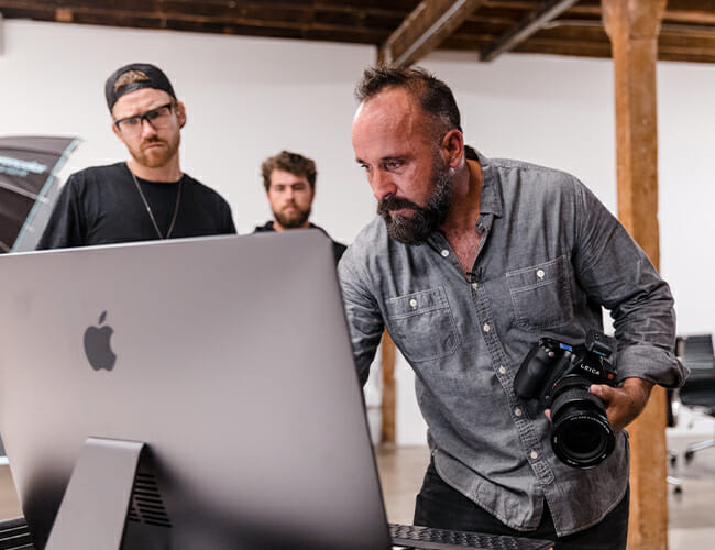 Photographer Michael Muller Shoots Sharks and People in the Same Light